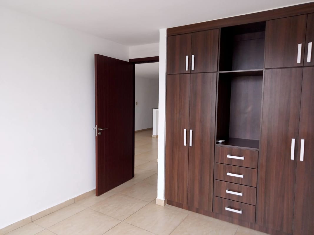 Bedroom with split AC unit, window, closet PH Condado Gardens Condado del Rey Panama