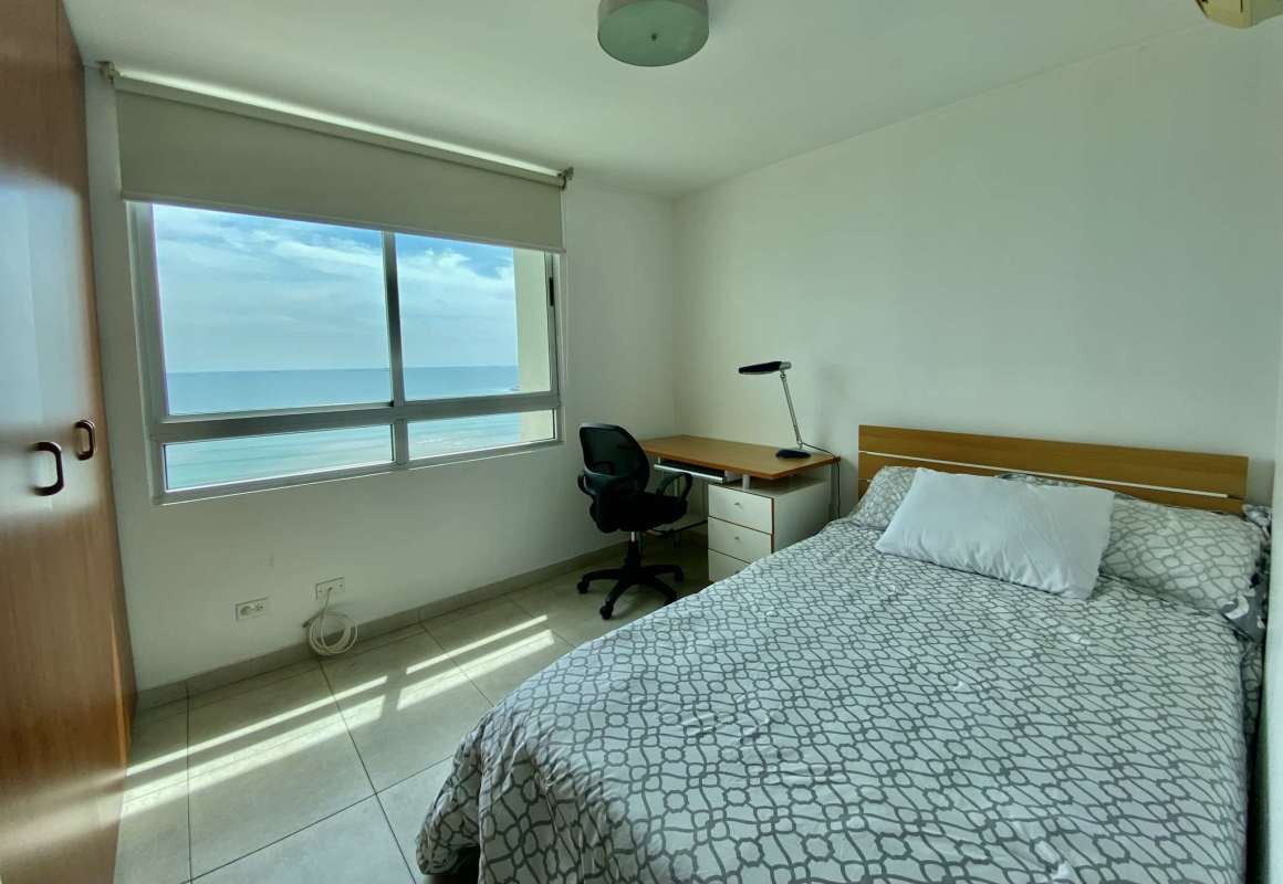 Modern living and dining space with large windows ocean view at PH Terrawind Panama