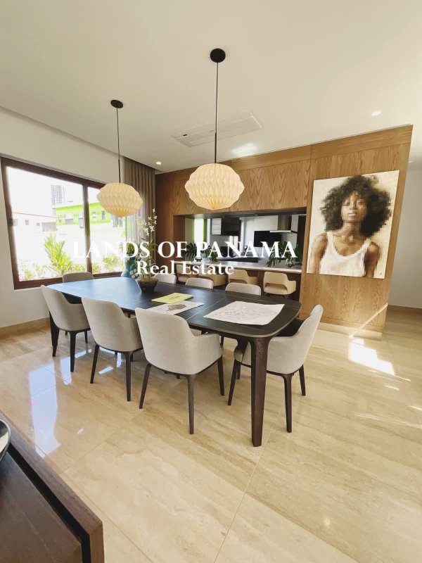 Formal dining with floor-to-ceiling windows and marble flooring at Santa María Panama