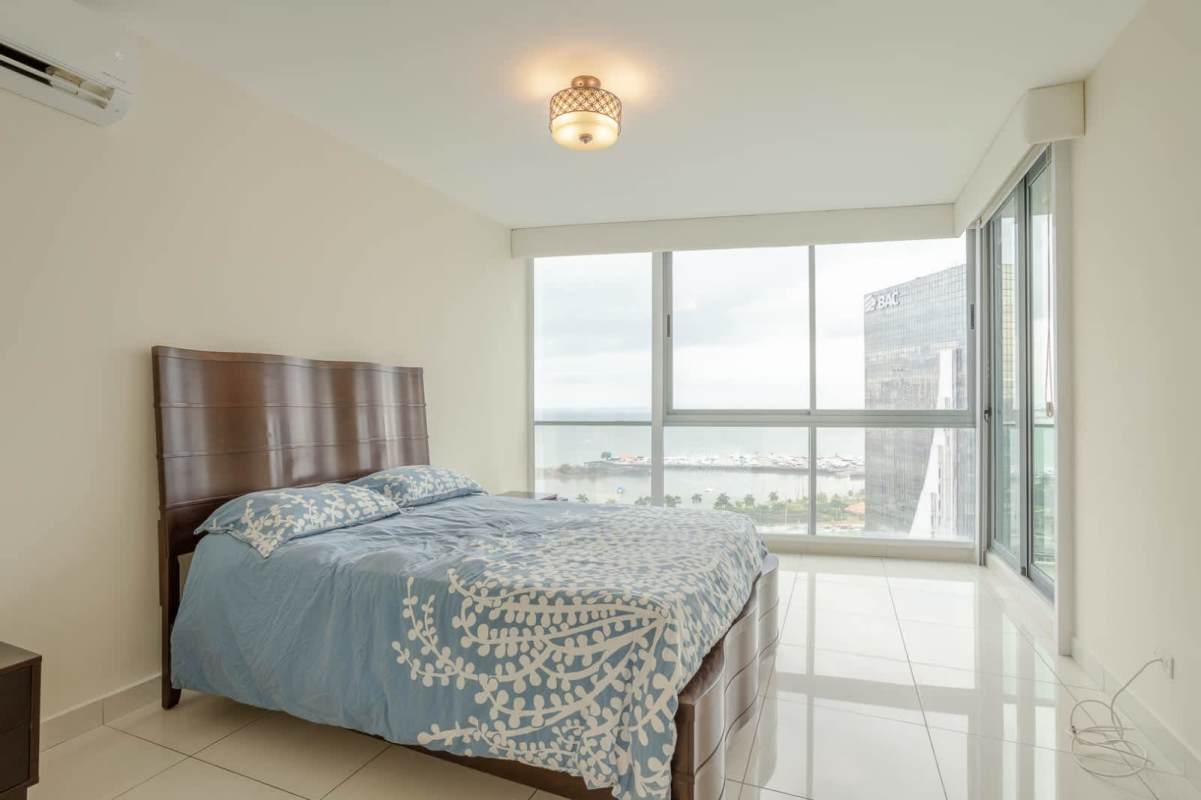 Dark wood walk-in closet with shelves and drawers in PH Allure Panama