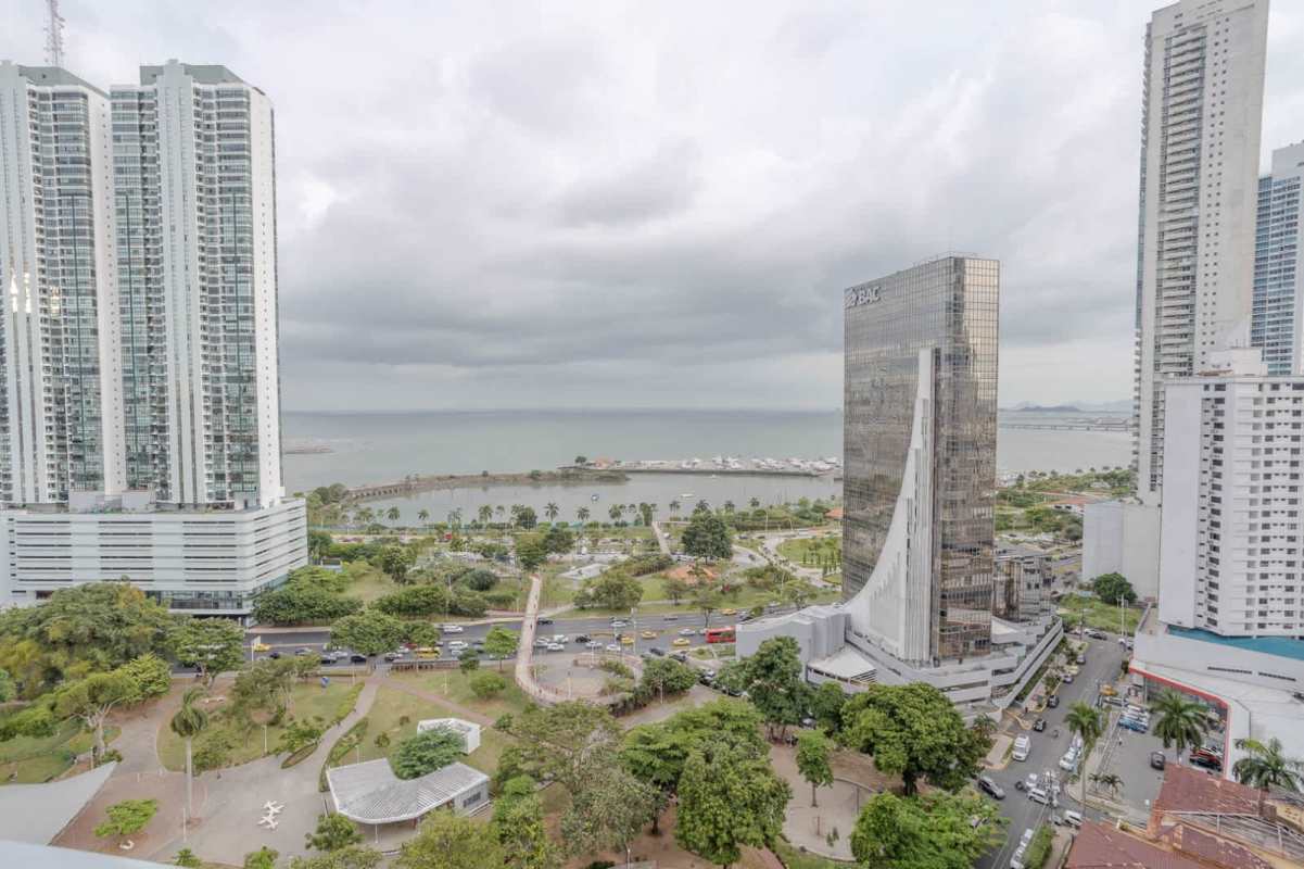 Modern bathroom with glass shower and granite vanity in PH Allure at the Park Panama