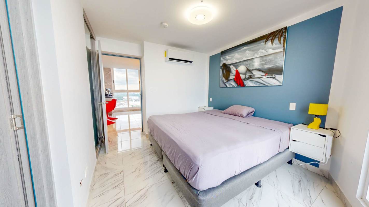 King bedroom with panoramic ocean skyline view and 65-inch TV at The Sands Avenida Balboa Panama City