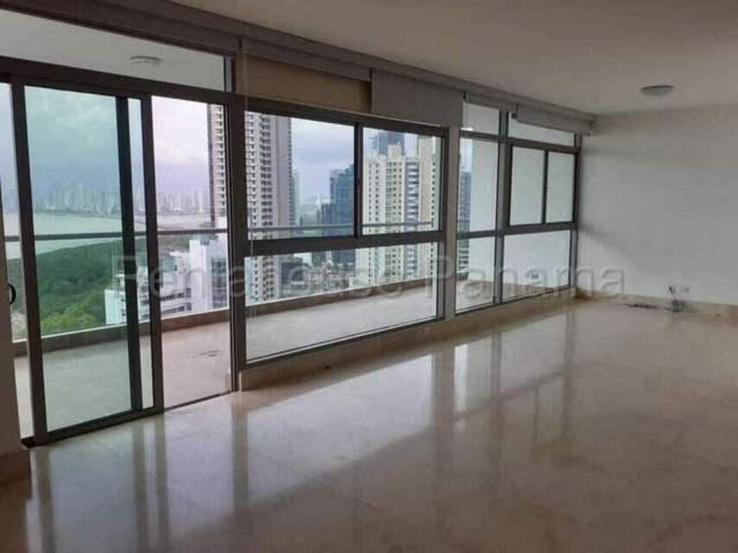 Large balcony with glass railing and oceanfront panoramic view from high-rise in Costa del Este Panama