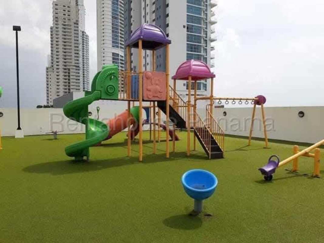 Colorful rooftop playground with slide climbing structures city view PH Costa del Este Panama