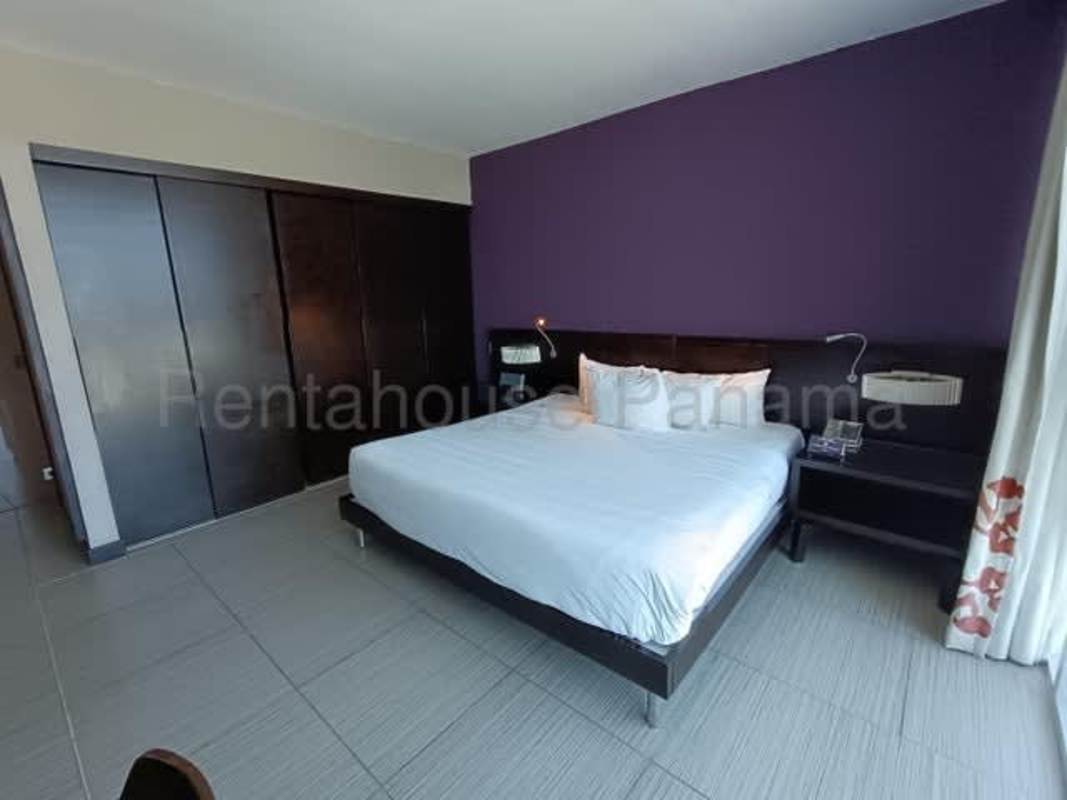 Modern luxury lobby with chandeliers, lounge seating Megapolis Tower