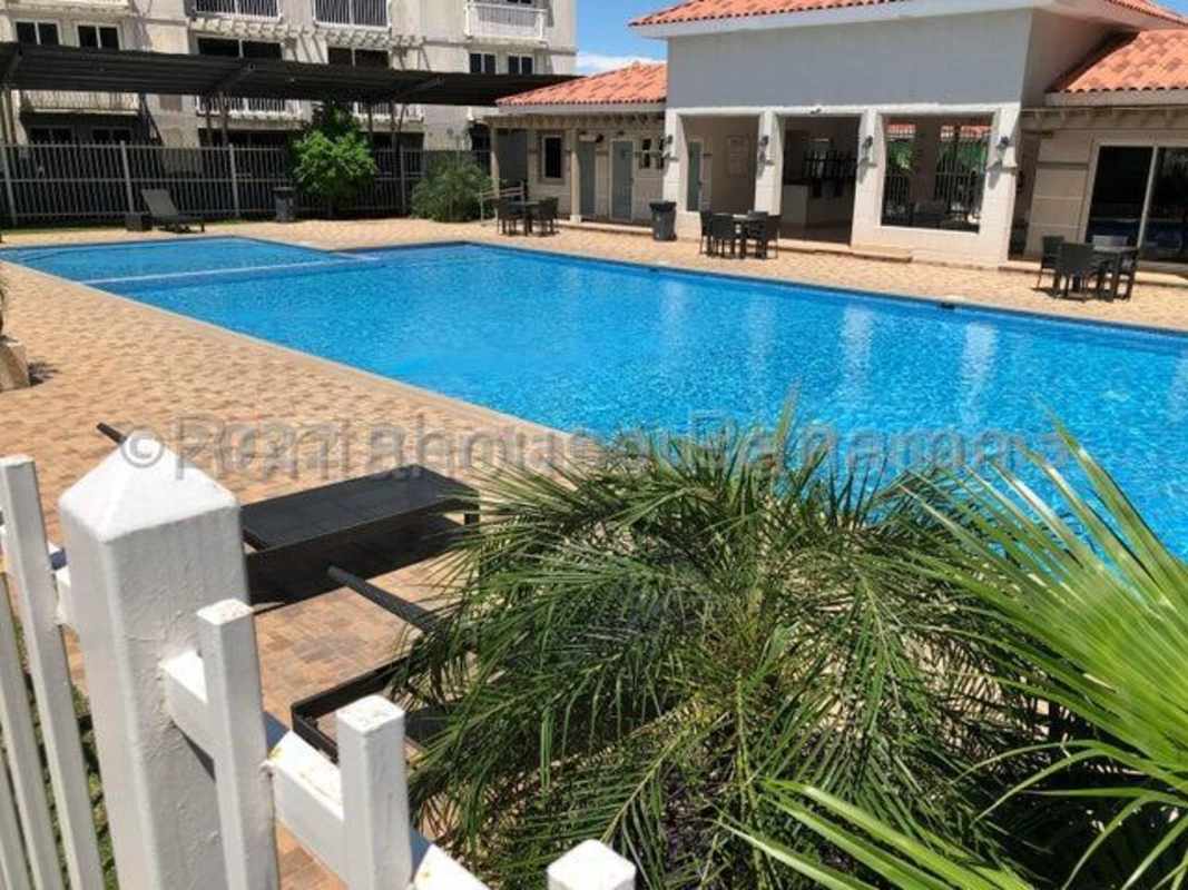 Large outdoor swimming pool with sun deck in Versalles gated community Costa Sur Panama