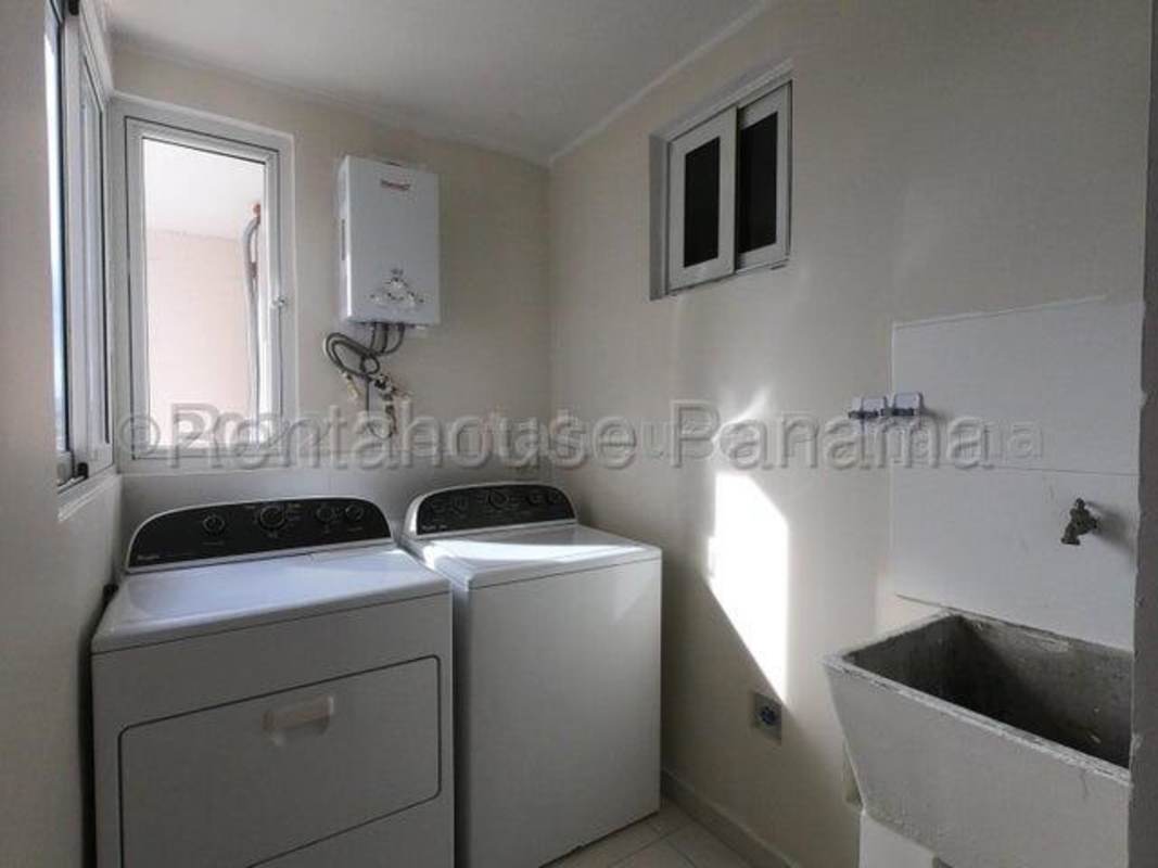 Laundry space with washer dryer hookups utility sink ventilation window Versalles Costa Sur Panama