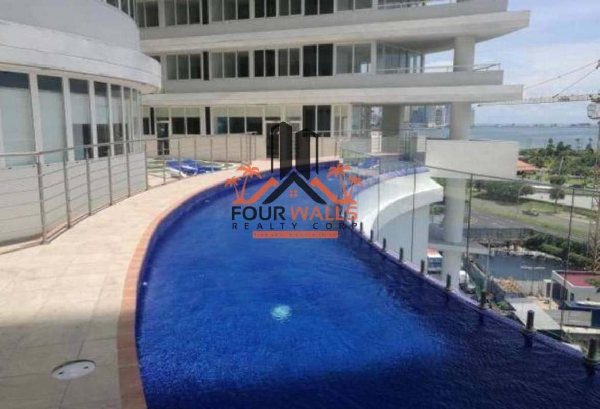 Rooftop curved infinity pool with skyline and ocean views at PH Bay View Panama