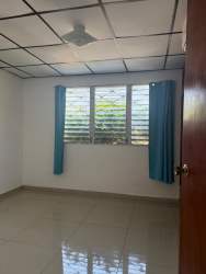 Bathroom glass enclosed shower toilet wooden shelves Villa Mercedes David