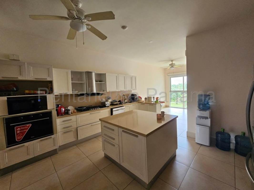 Spacious kitchen with island, marble countertops, built-in appliances PH Santa Maria Panama