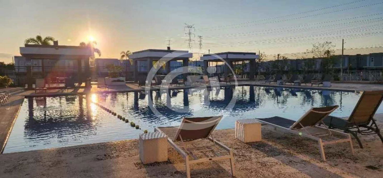 Modern swimming pool with lounge chairs cabanas landscaping PH Augusta Brisas del Golf Panama