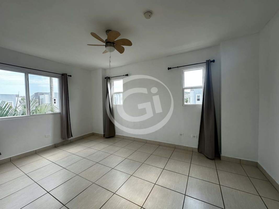 Empty bedroom with balcony sliding doors ceiling fan AC PH Augusta Brisas del Golf Panama