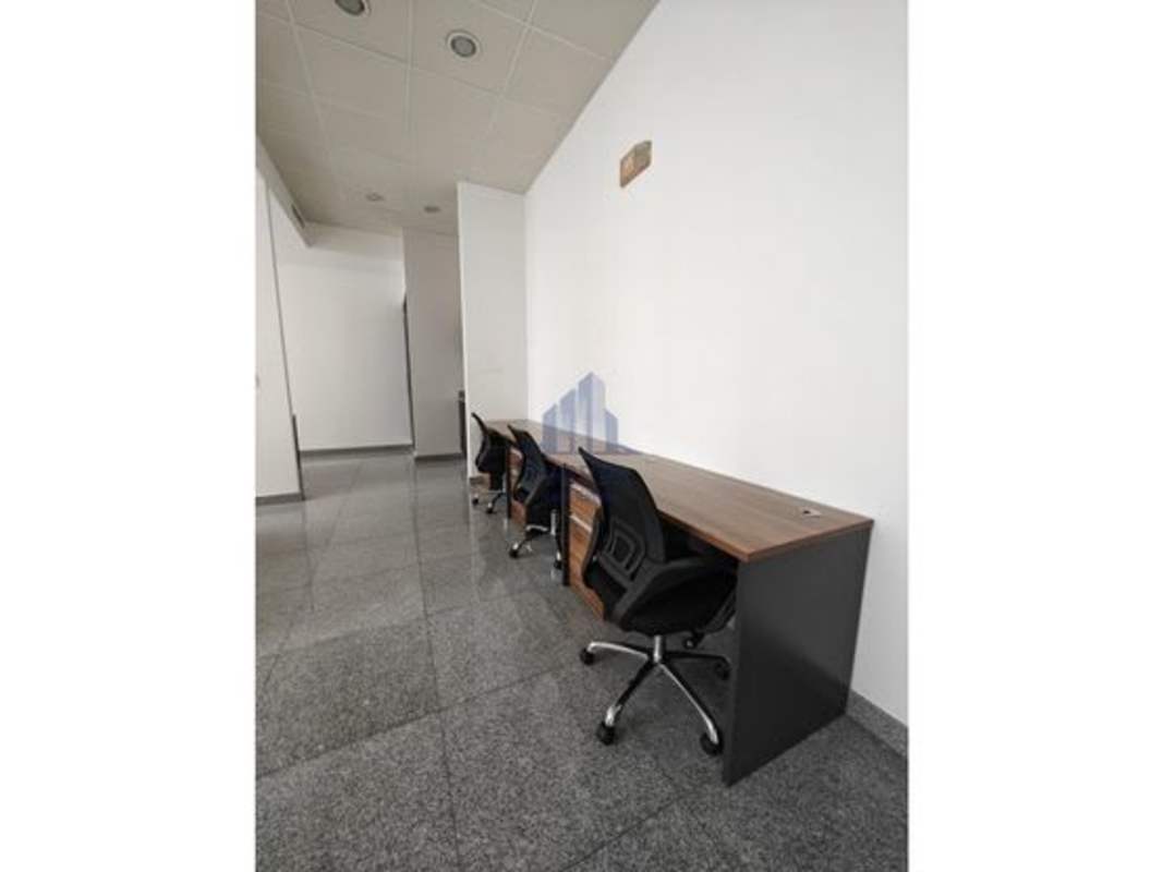 Minimalist private office area furnished with desk, granite flooring and panoramic view at PH BICSA Tower Panama