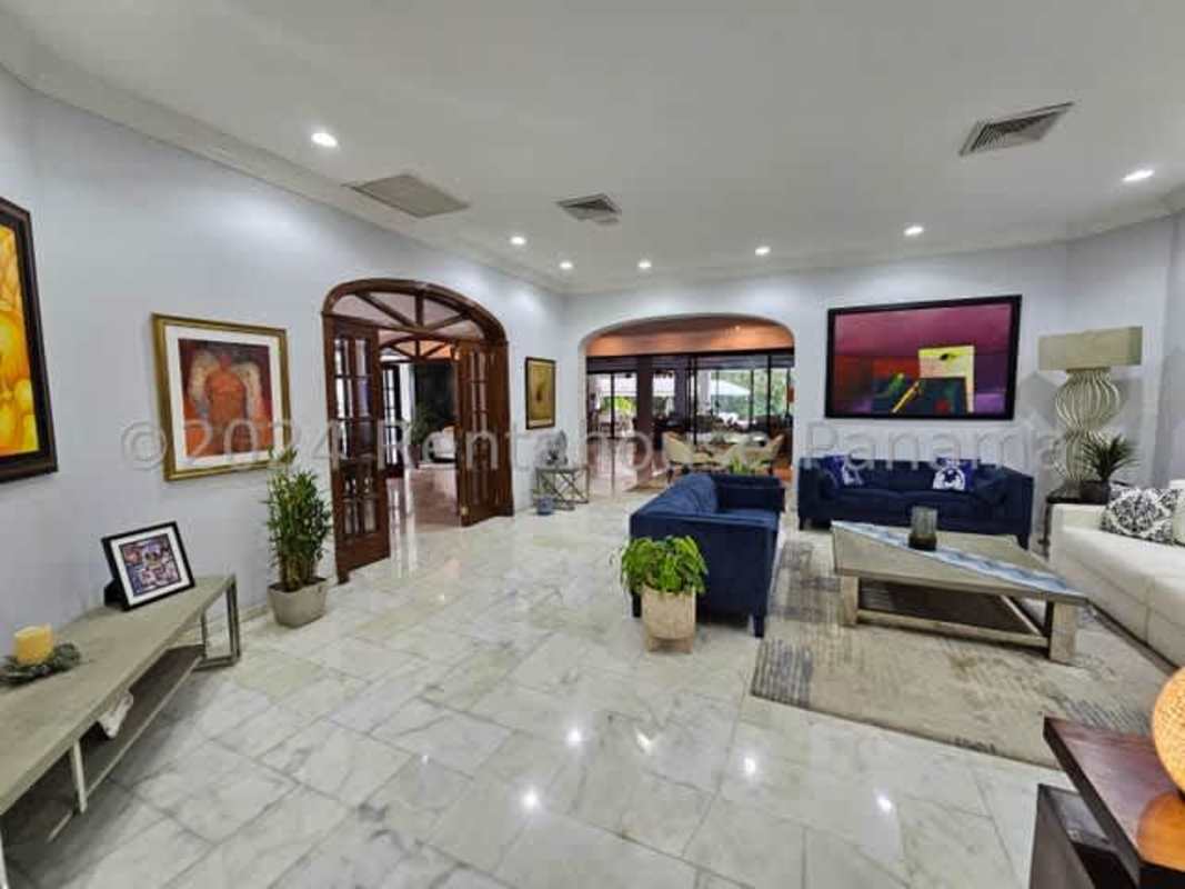 Private swimming pool surrounded by tropical gardens at luxury house in Altos del Golf Panama