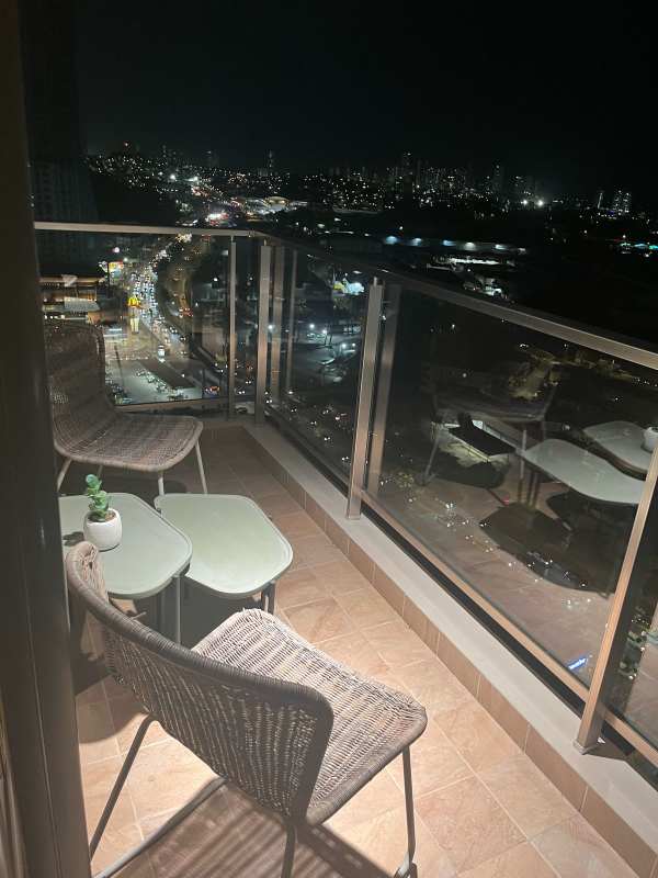 Private balcony overlooking city skyline at night PH Spotlight Tumba Muerto Panama