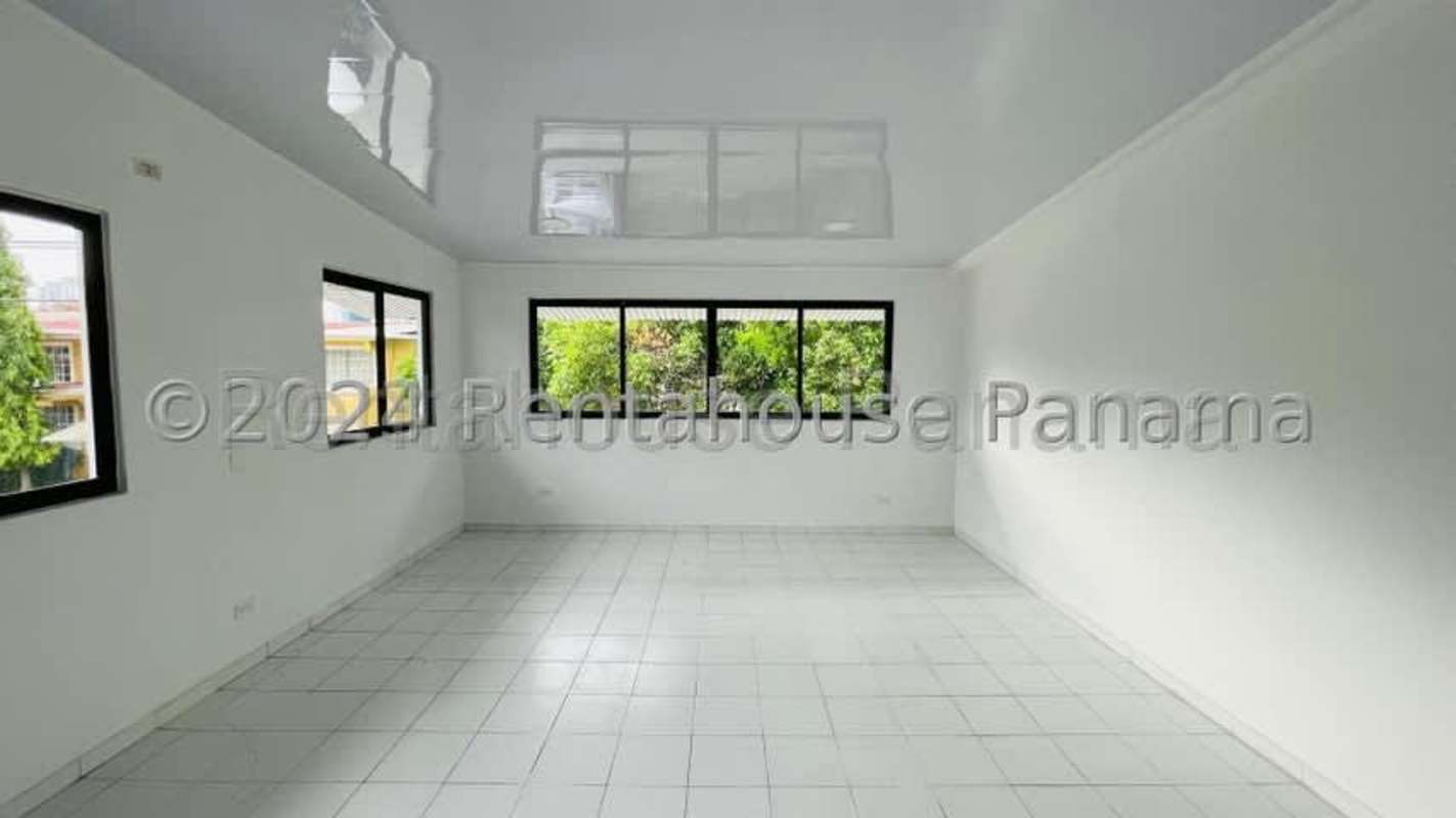 Bright empty living space with black-framed windows Panama City