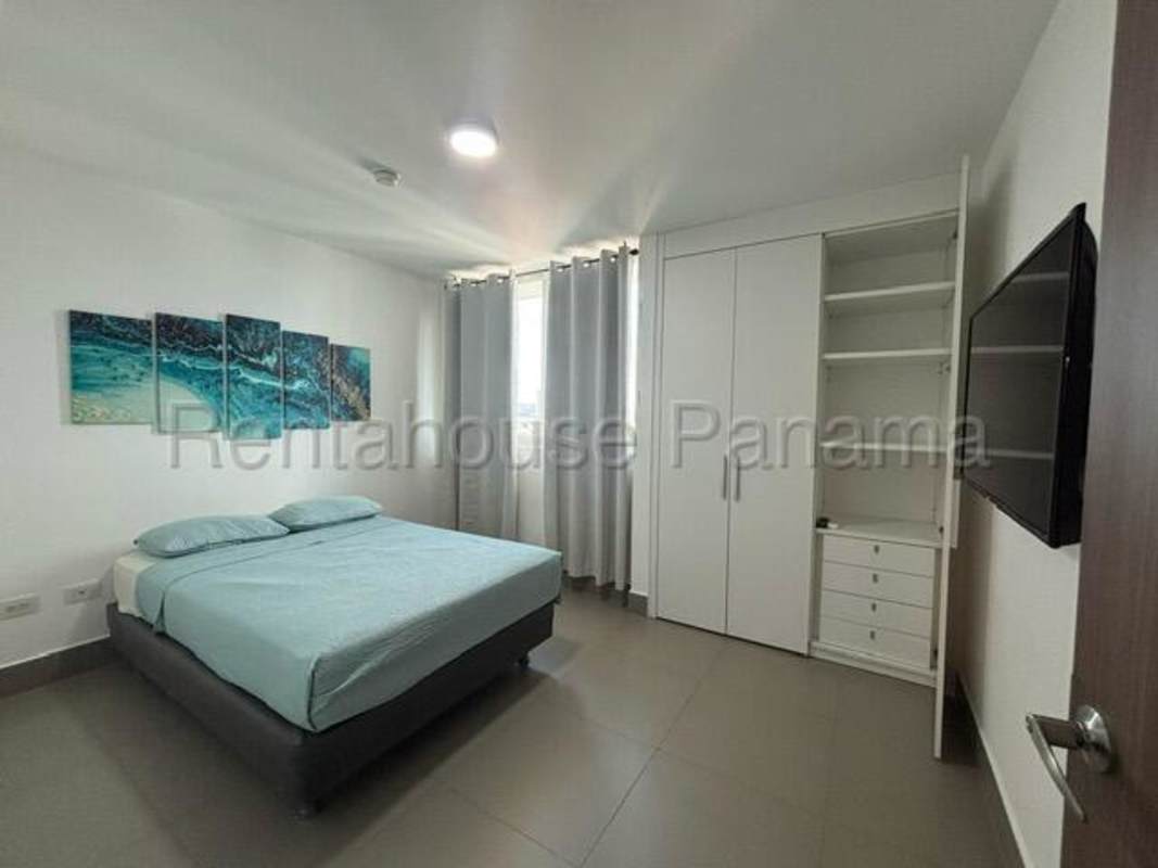 Modern bedroom with AC unit, window, closet and city view in Altamira Residences Panama