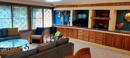 Duplex exterior white facade porch driveway in APRUCC Gorgona Panama Beach