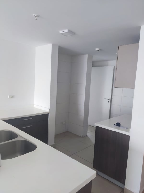 Bright living room with sliding doors opening to a balcony city view PH Scala El Carmen