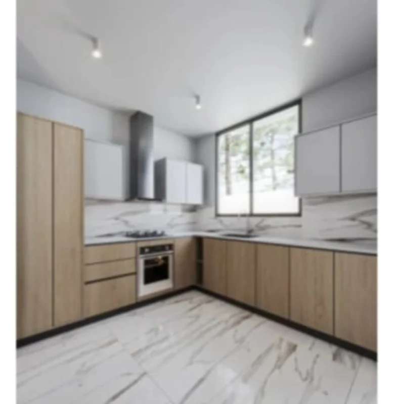 Modern living room open to kitchen with marble floors and natural light in Albrook Green Residences Panama