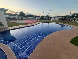 Swimming pool with gazebo and children's playground in secure gated Residencial Vista Alegre Nuevo Emperador Panama