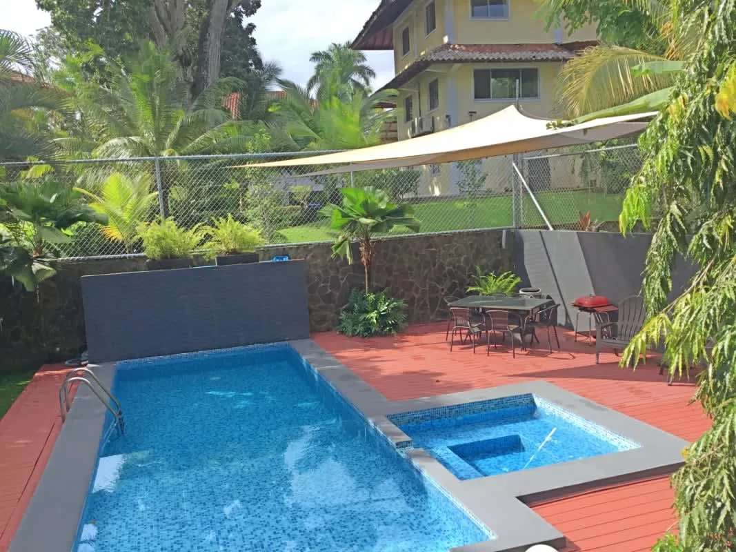 Private outdoor swimming pool, spa, deck with lounge, lush tropical garden Panama