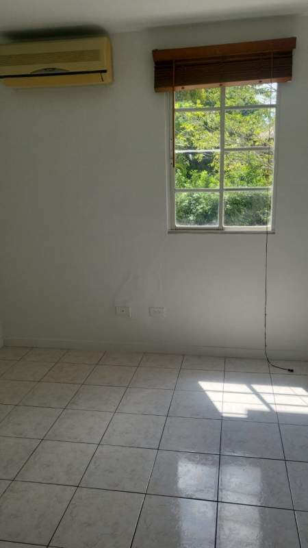 Bright living room with balcony access and tiled floors in PH Albrook Park Clayton Panama