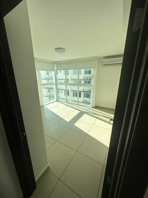 Modern bedroom with large window, split AC, tile flooring at PH Kings Park Panama
