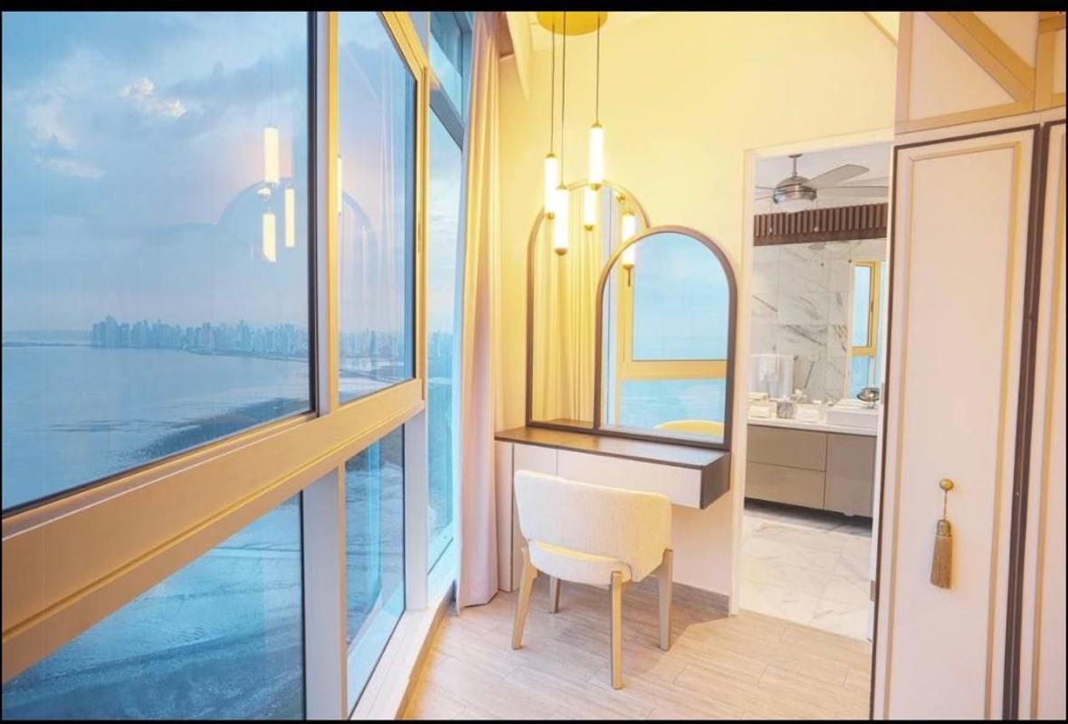 State-of-the-art kitchen with stainless steel appliances quartz countertop at PH The Pearl penthouse Costa del Este