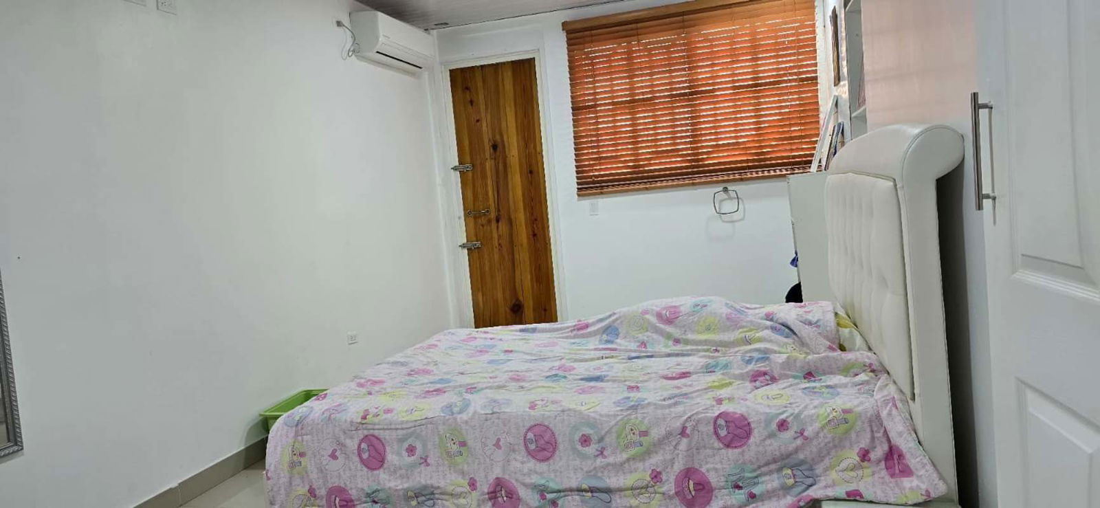 Large bedroom with AC, wood accents and bright windows PH Altos del Country Panama