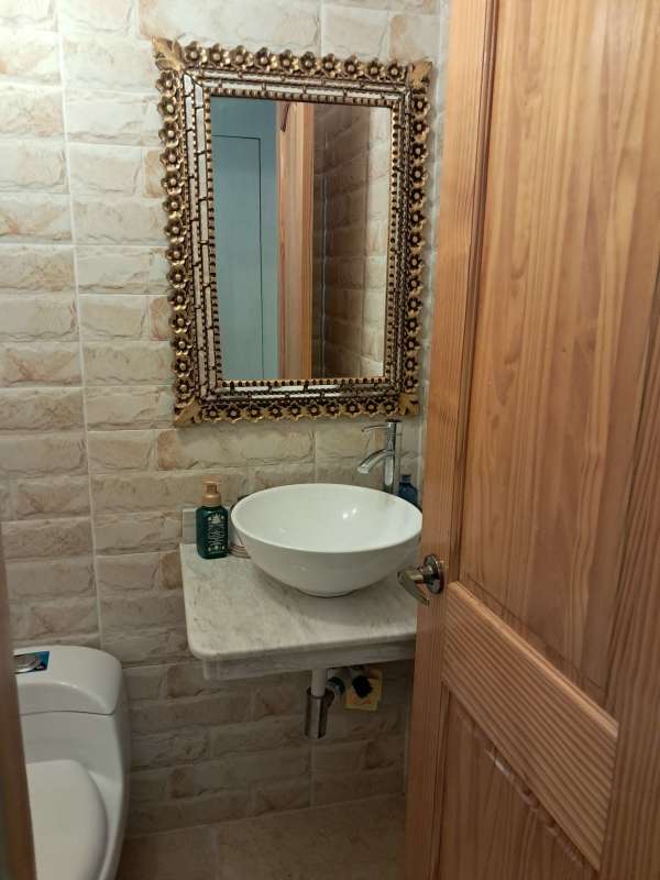 Compact bathroom with vessel sink marble top Edison Corporate Center Panama