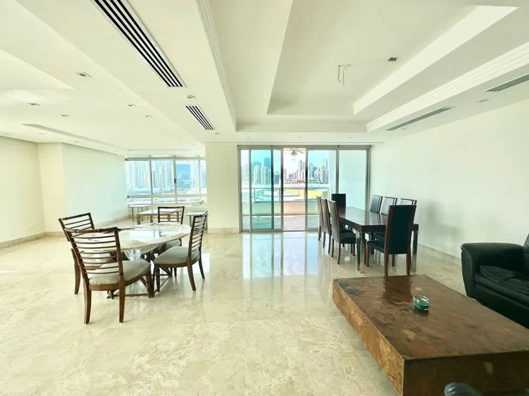 Large living and dining room with marble floors and expansive city views in PH Terrazas del Pacífico Panama City