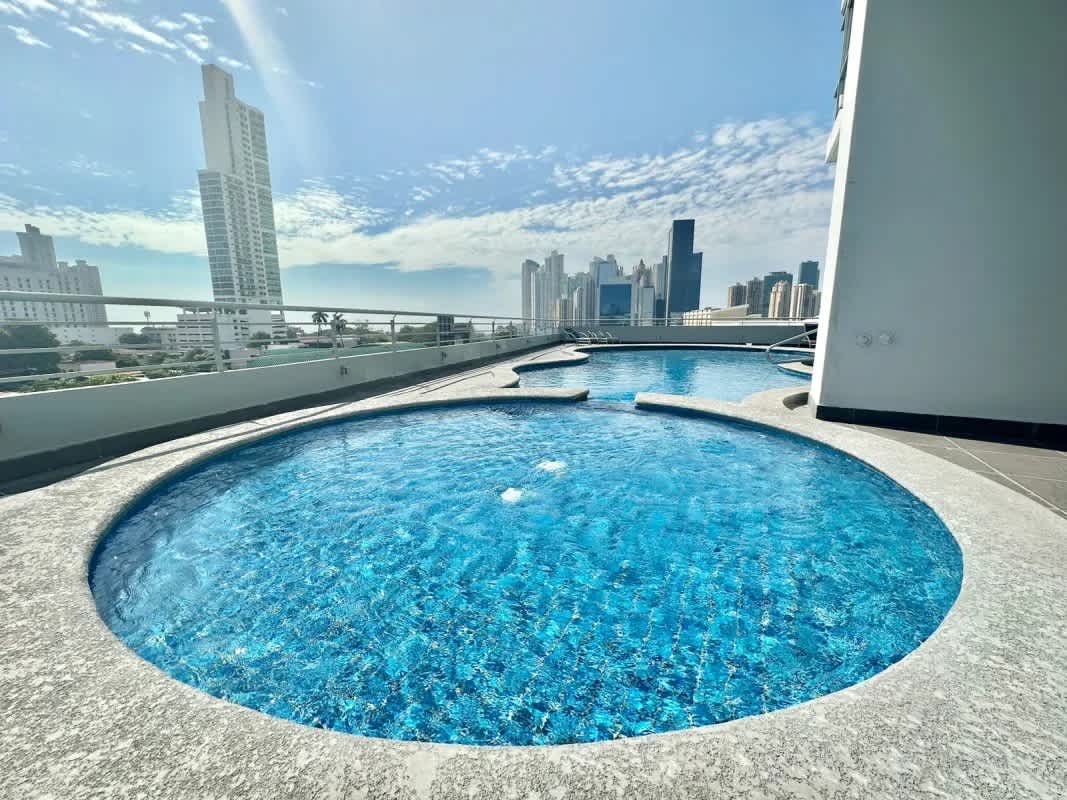 Spacious covered balcony with panoramic views of Panama City skyline at Terrazas del Pacífico