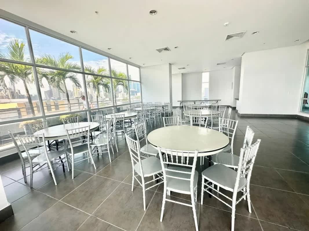 Master bedroom with panoramic windows and stunning skyline view at PH Terrazas del Pacífico