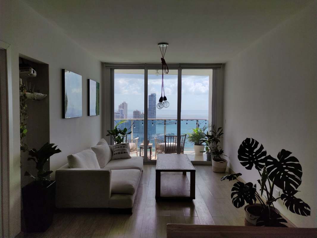 Open-plan living dining with ocean front balcony PH White Tower Avenida Balboa Panama