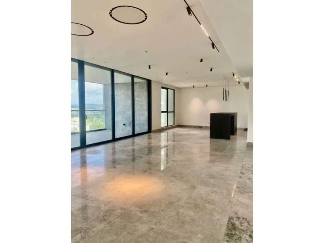 Spacious living and dining room with marble floors, panoramic windows, balcony access Empire Residences Panama
