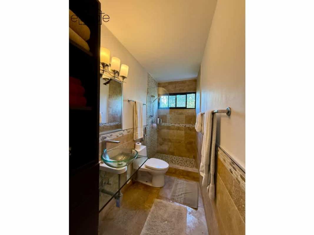 Marble clad guest bathroom with designer sink at PH Elite La Cresta Panama