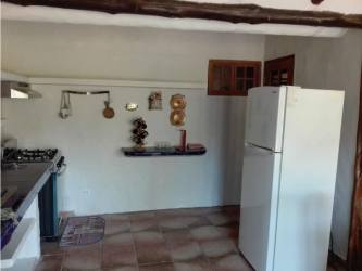 Kitchen with blue tile, oven, wooden beams, dining set Coronado Panama rental house