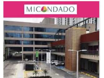 Facade of Mi Condado Plaza commercial property with signage and glass windows in Panama