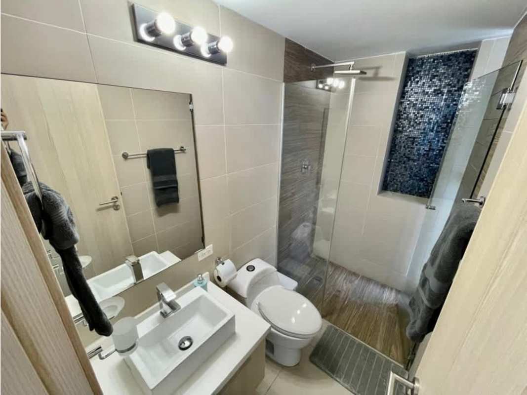 Elegant bathroom with large mirror and glass shower enclosure PH Scala Panama City
