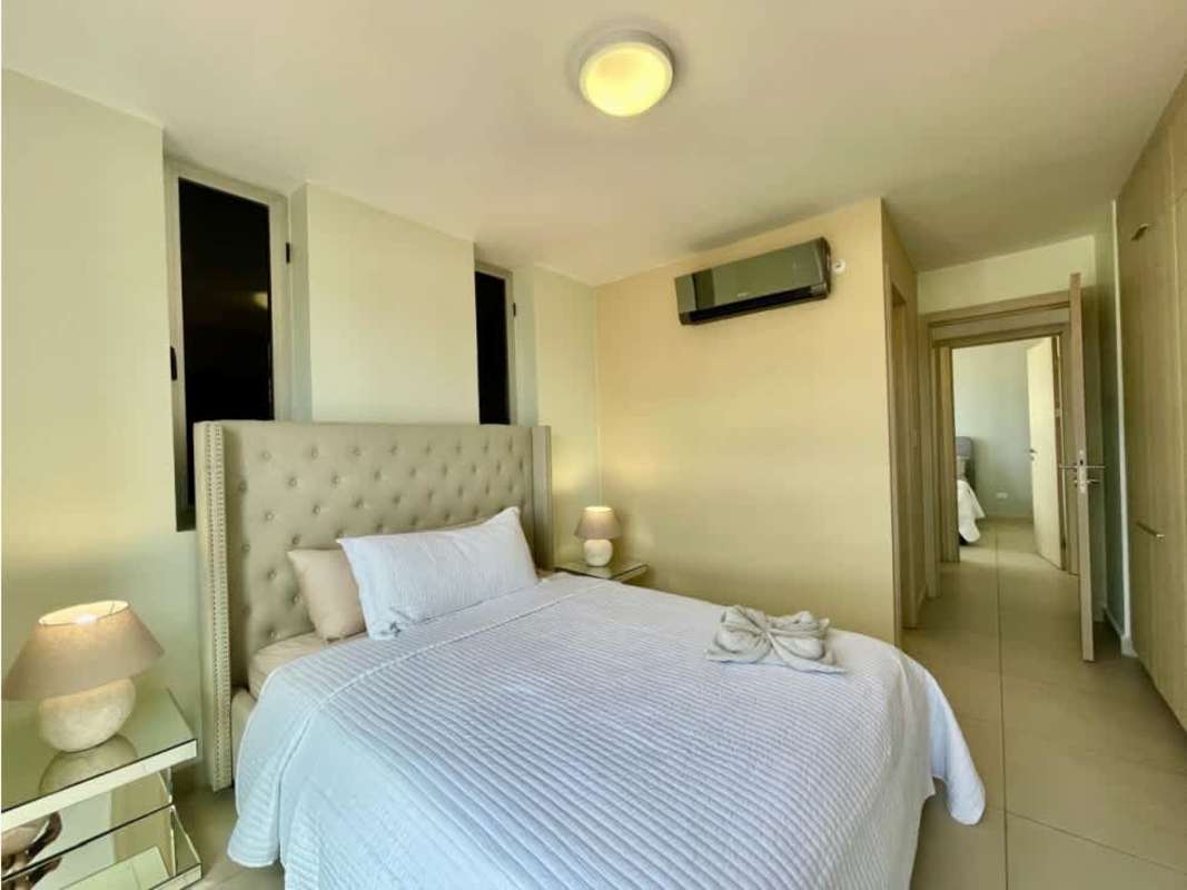 Modern minimalist bedroom with large window in PH Scala El Carmen Panama City