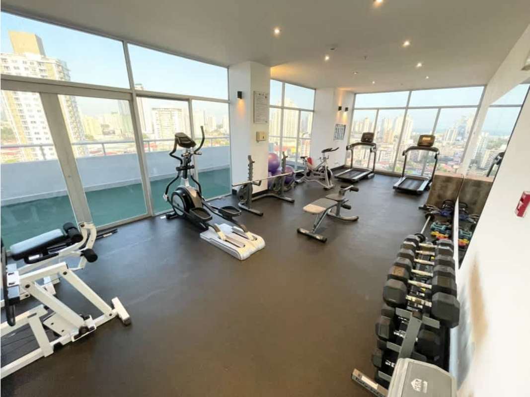 Large gym with cardio machines and panoramic city views PH Scala Panama