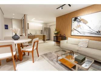 Modern L-shaped kitchen with wooden cabinetry at PH Mi Condado in Panama