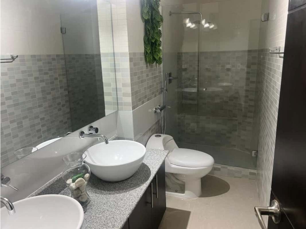 Modern bathroom with dual sinks and shower at Titanium Tower San Francisco Panama for rent