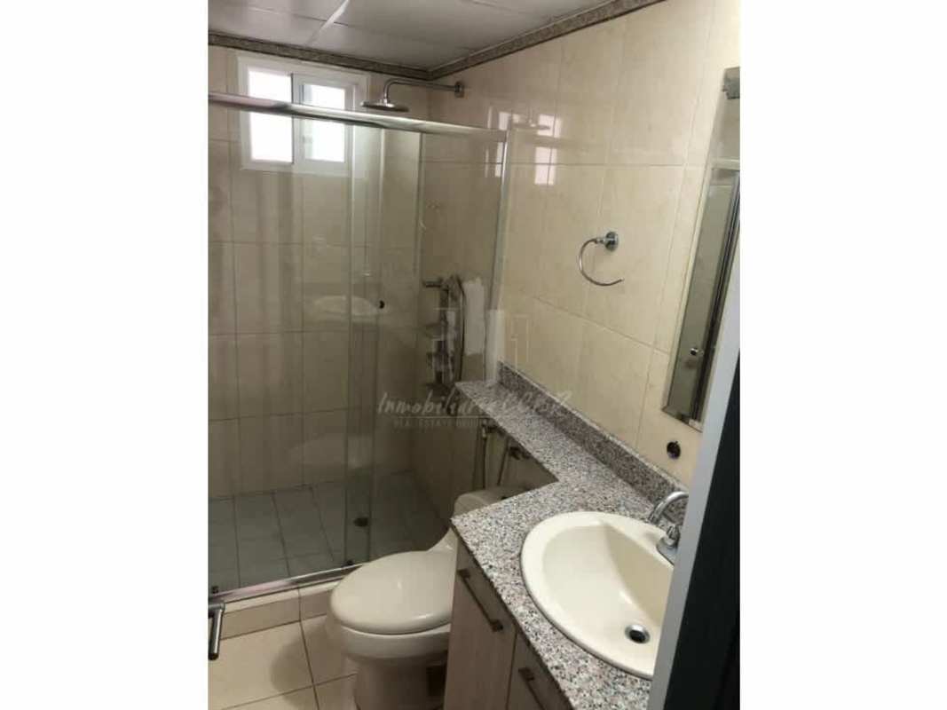 Bathroom with glass enclosed shower, granite vanity and modern fixtures at PH Sabana Tower 12 de Octubre Panama City