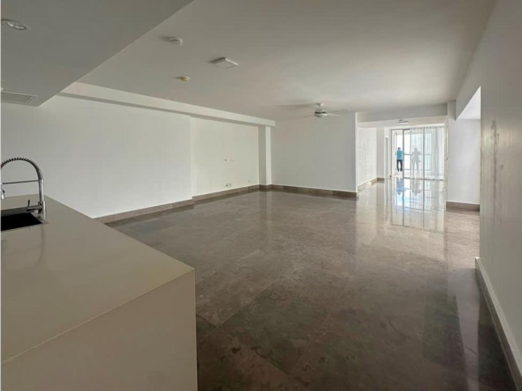 Modern open-plan living area with large windows and kitchen island PH YOO Panama