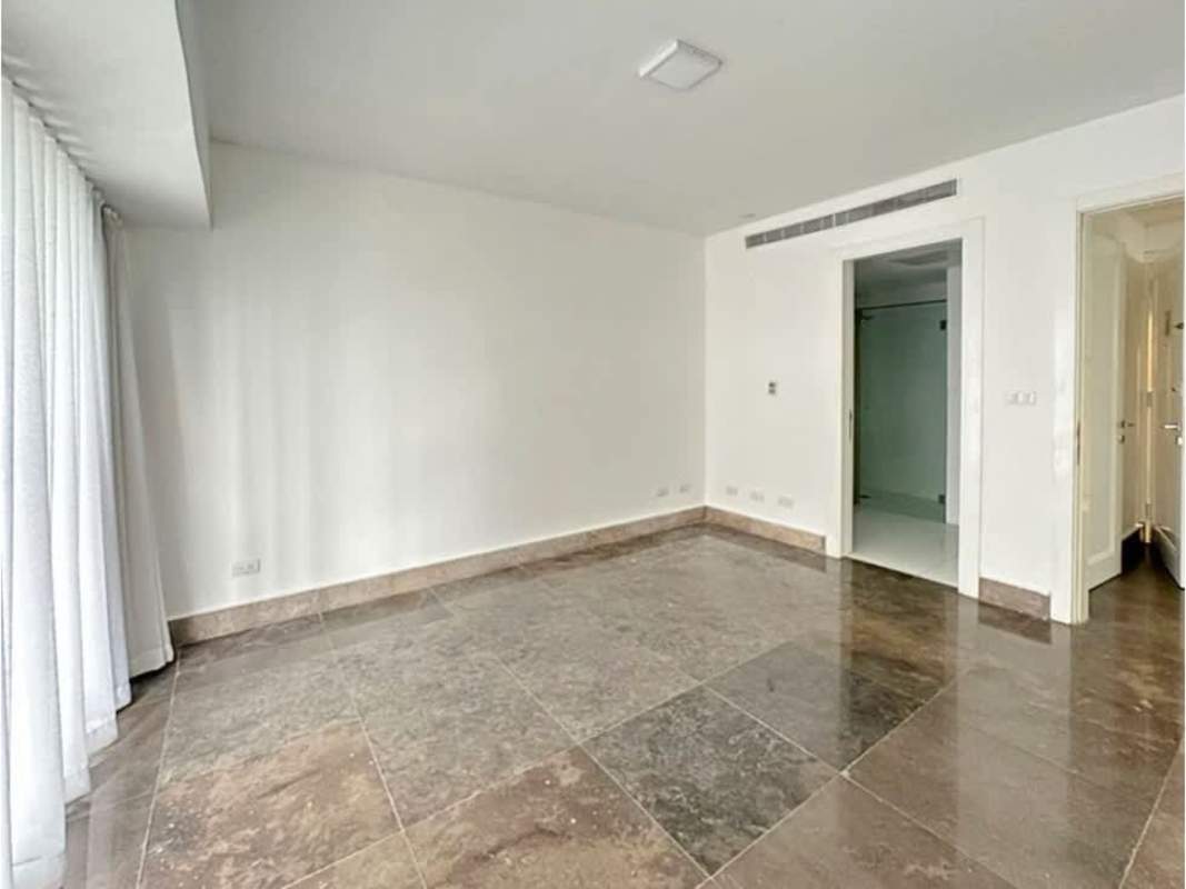 Modern master bedroom with large windows and ensuite bathroom at YOO Panama