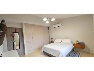 Bright bedroom with large window and closet in Bosques del Pacífico Panama Pacifico