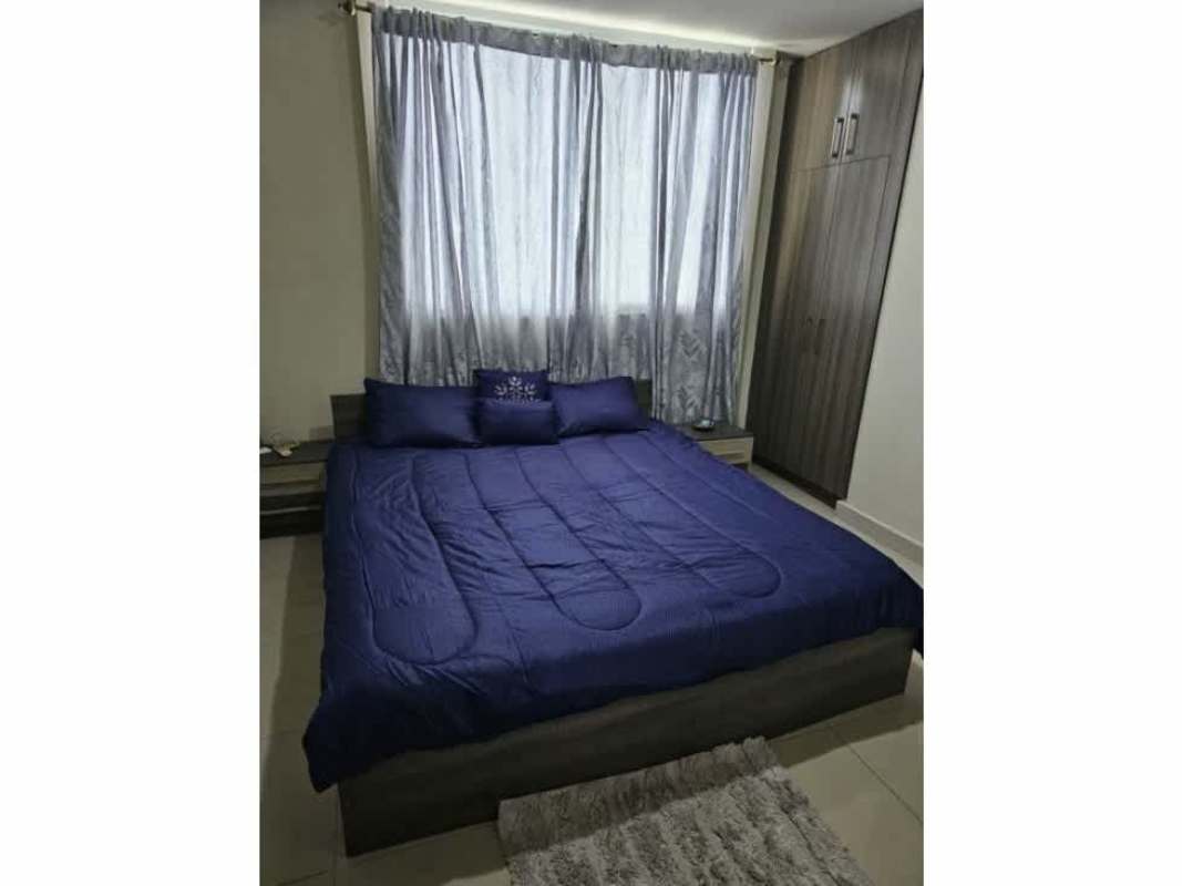 Lobby seating with green chairs and modern decor at Residencias del Sol Panama City