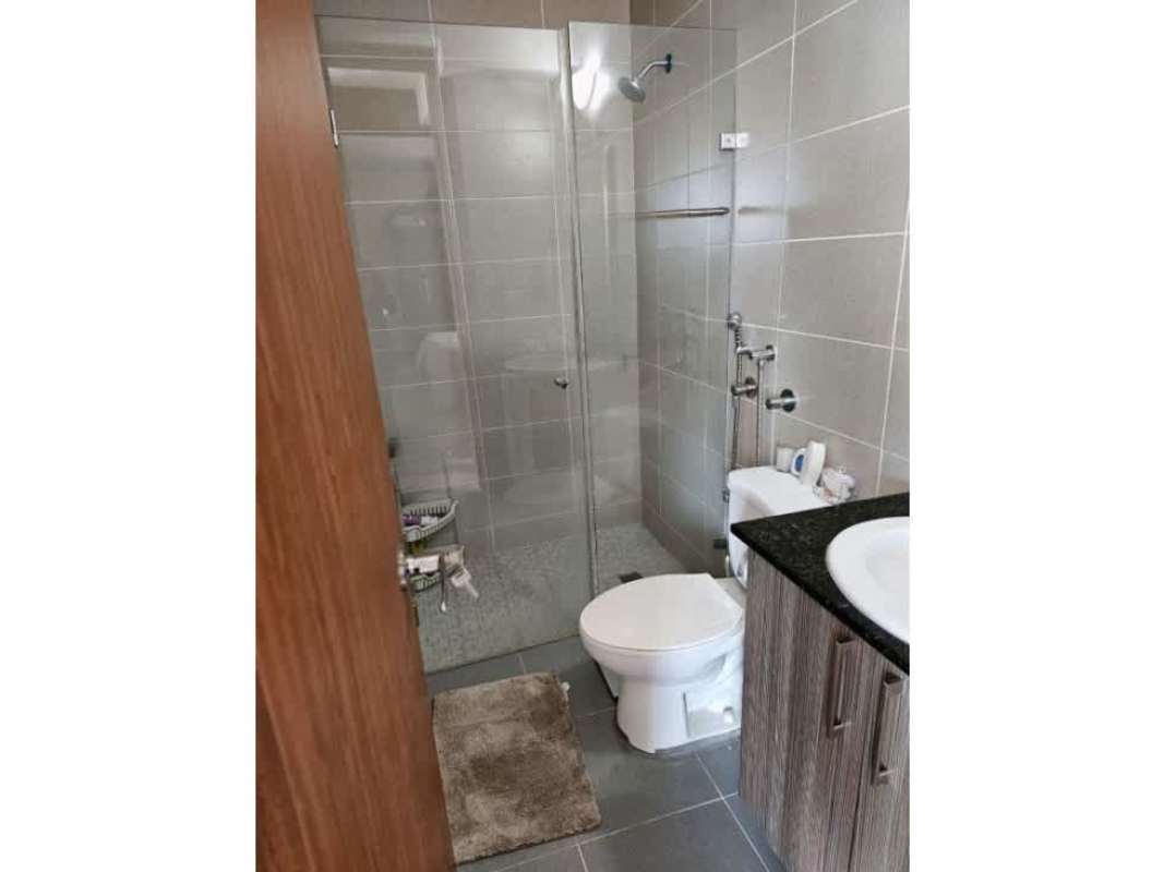 Modern bathroom with vanity, mirror, and shower enclosure PH Residencias del Sol Carrasquilla Panama